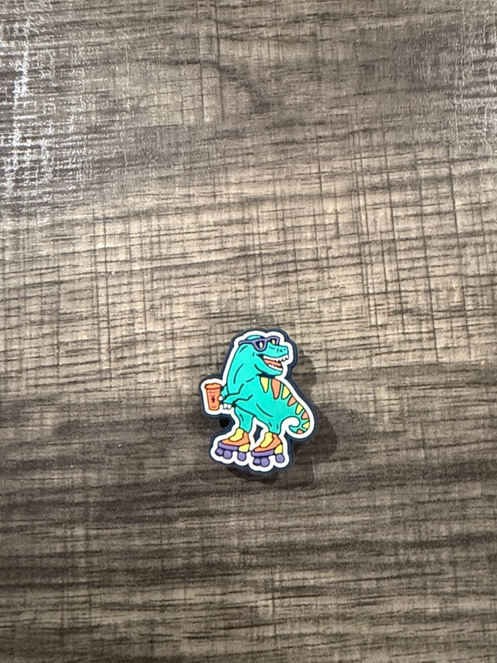 Dutch Bros T-Rex with rollerskates and a drink shoe charm